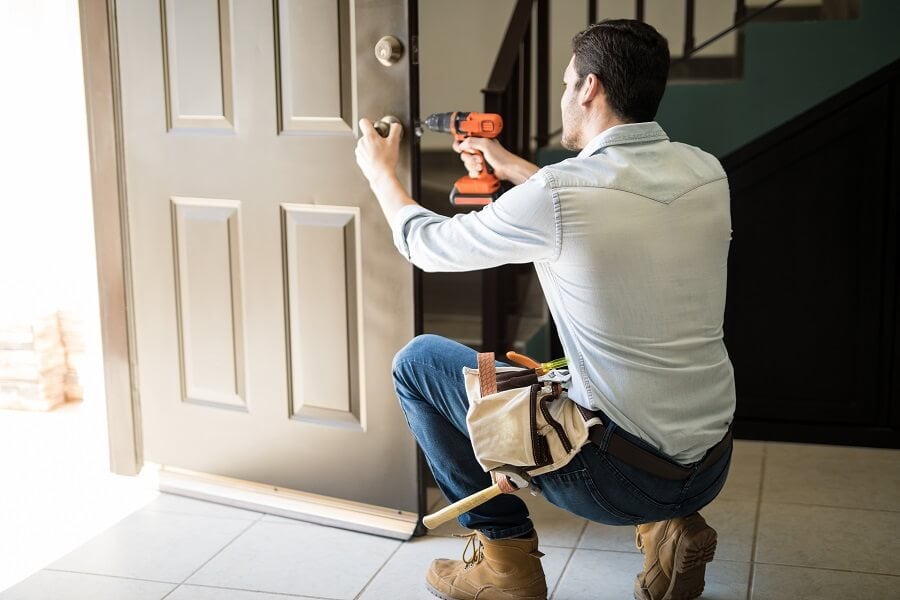 Fitting a new lock on the back door.